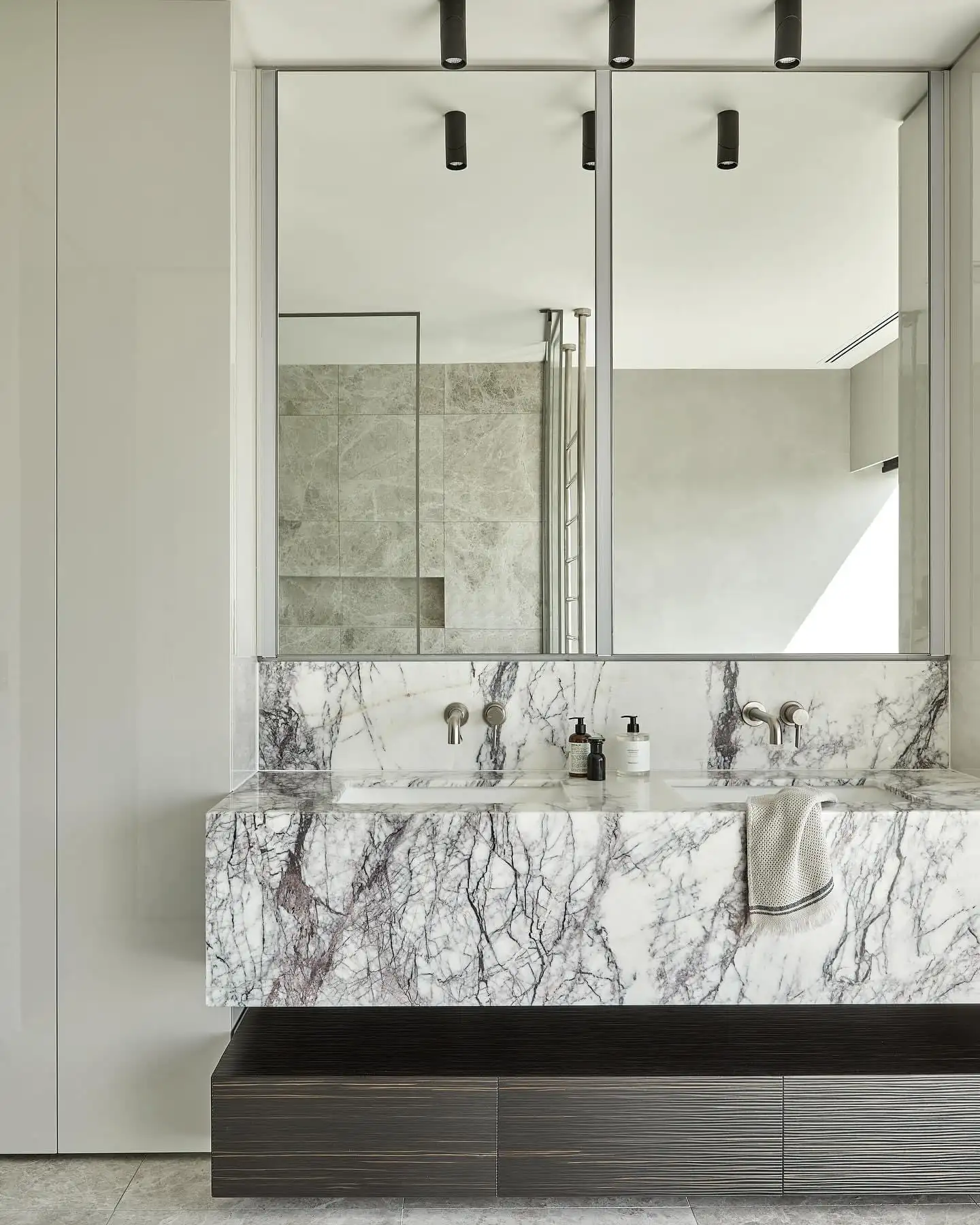 Full-height marble wall cladding in a Melbourne luxury bathroom, showcasing precision stone fabrication by Pazzi Marble & Granite.