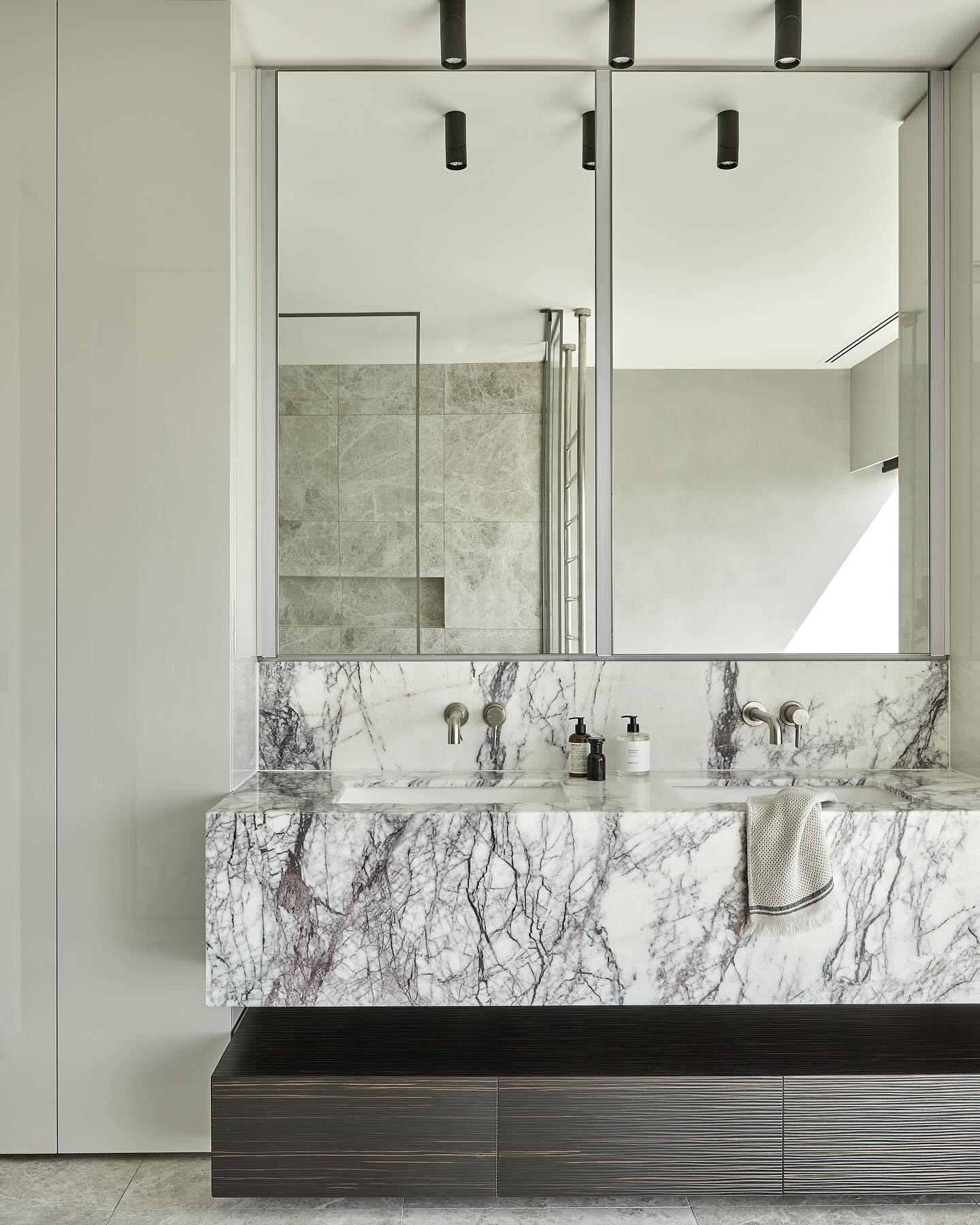 Full-height marble wall cladding in a Melbourne luxury bathroom, showcasing precision stone fabrication by Pazzi Marble & Granite.