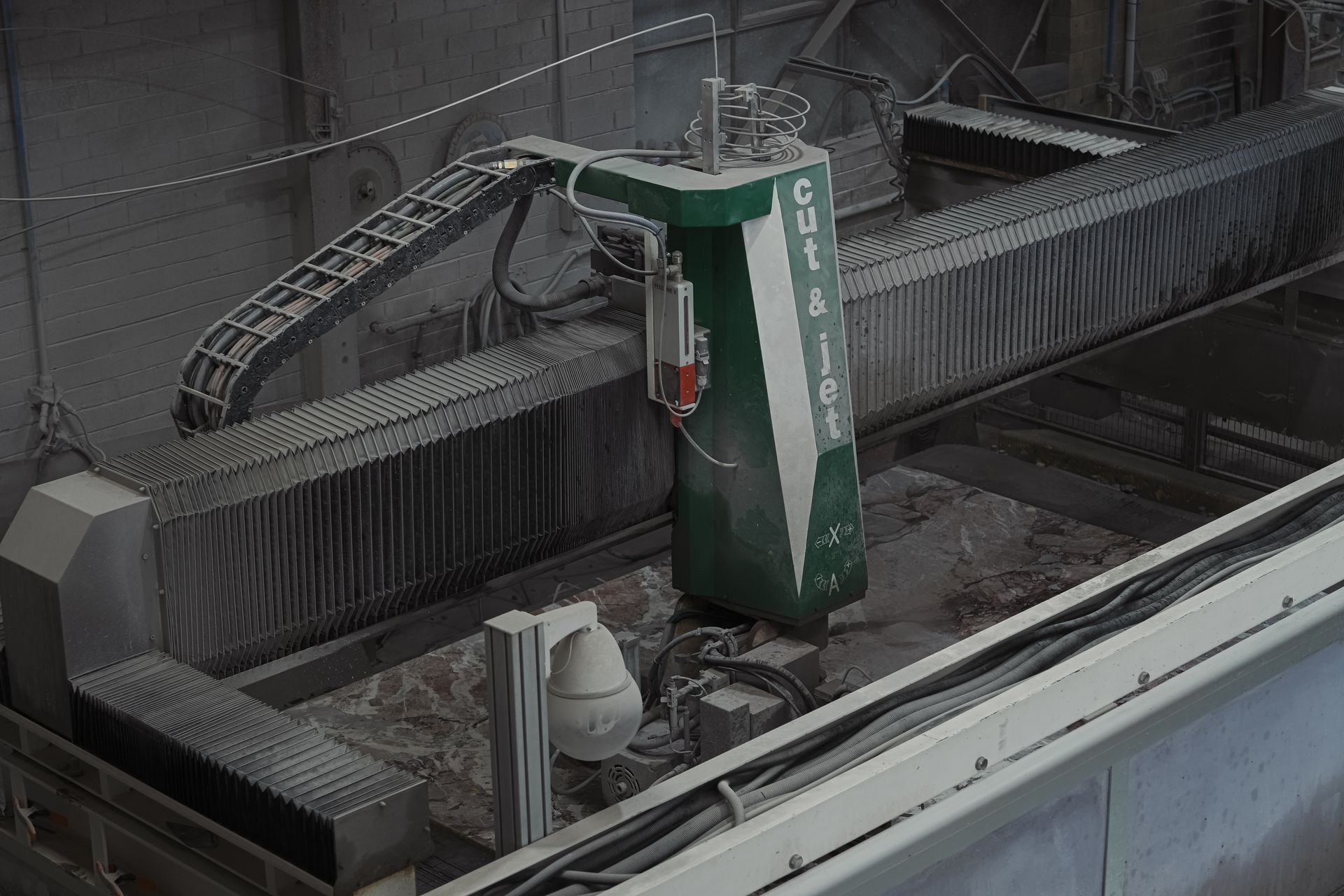 CNC router shaping marble for curved edges and mitred joins in high-end Melbourne home.